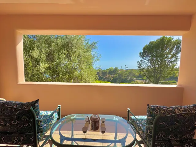 a bedroom with a large bed and a large window