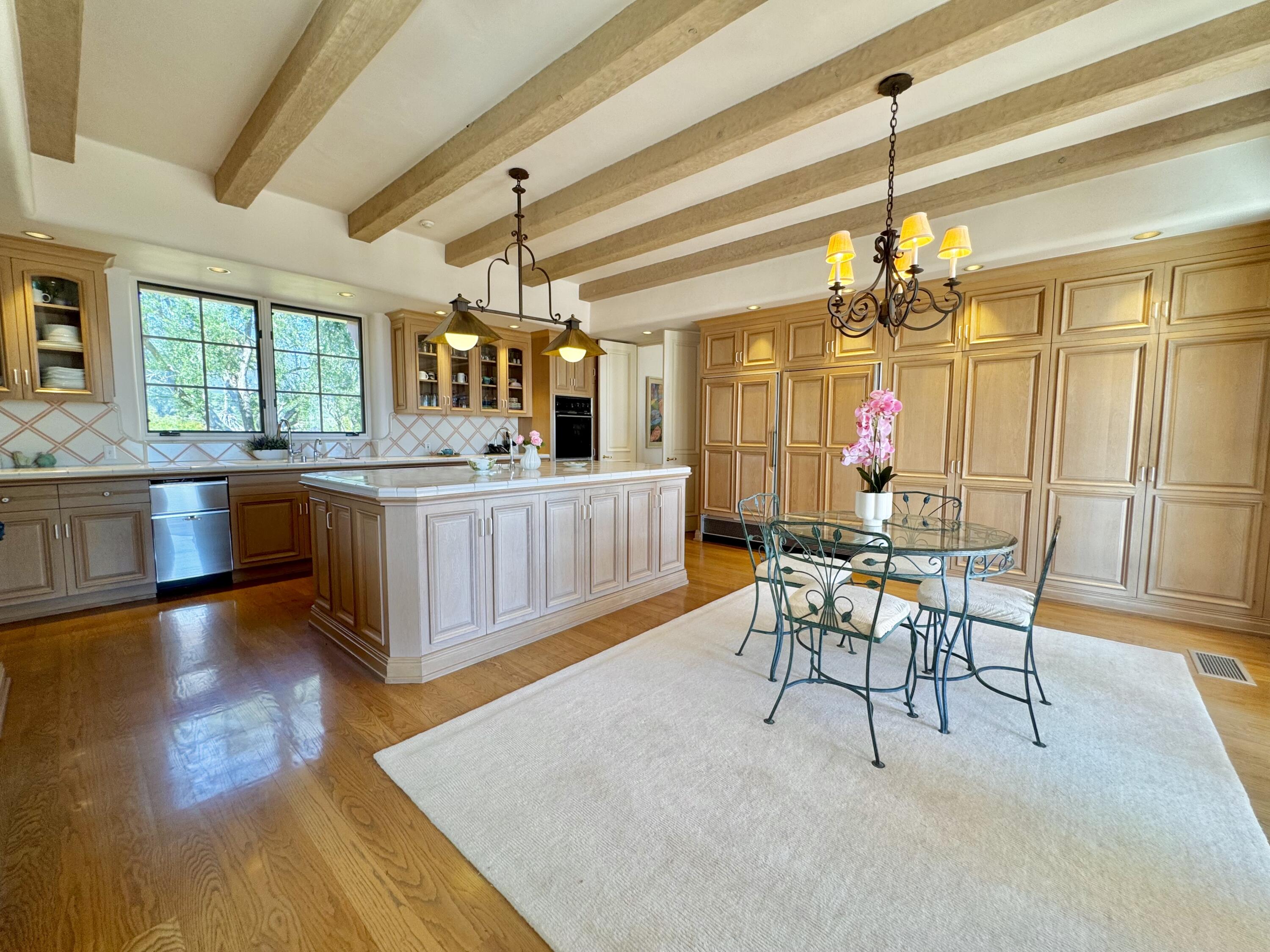 2240 Ortega Ranch Road Summerland, CA 93067 - Photo 33 of 87 a view of a dining room with furniture window and wooden floor