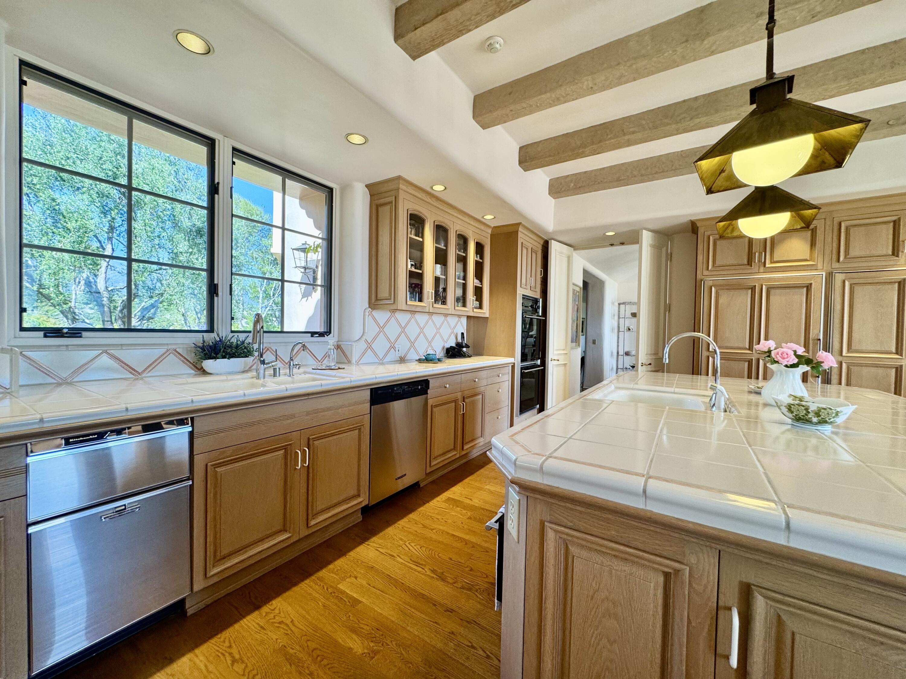2240 Ortega Ranch Road Summerland, CA 93067 - Photo 35 of 87 a kitchen with stainless steel appliances granite countertop a sink and a stove