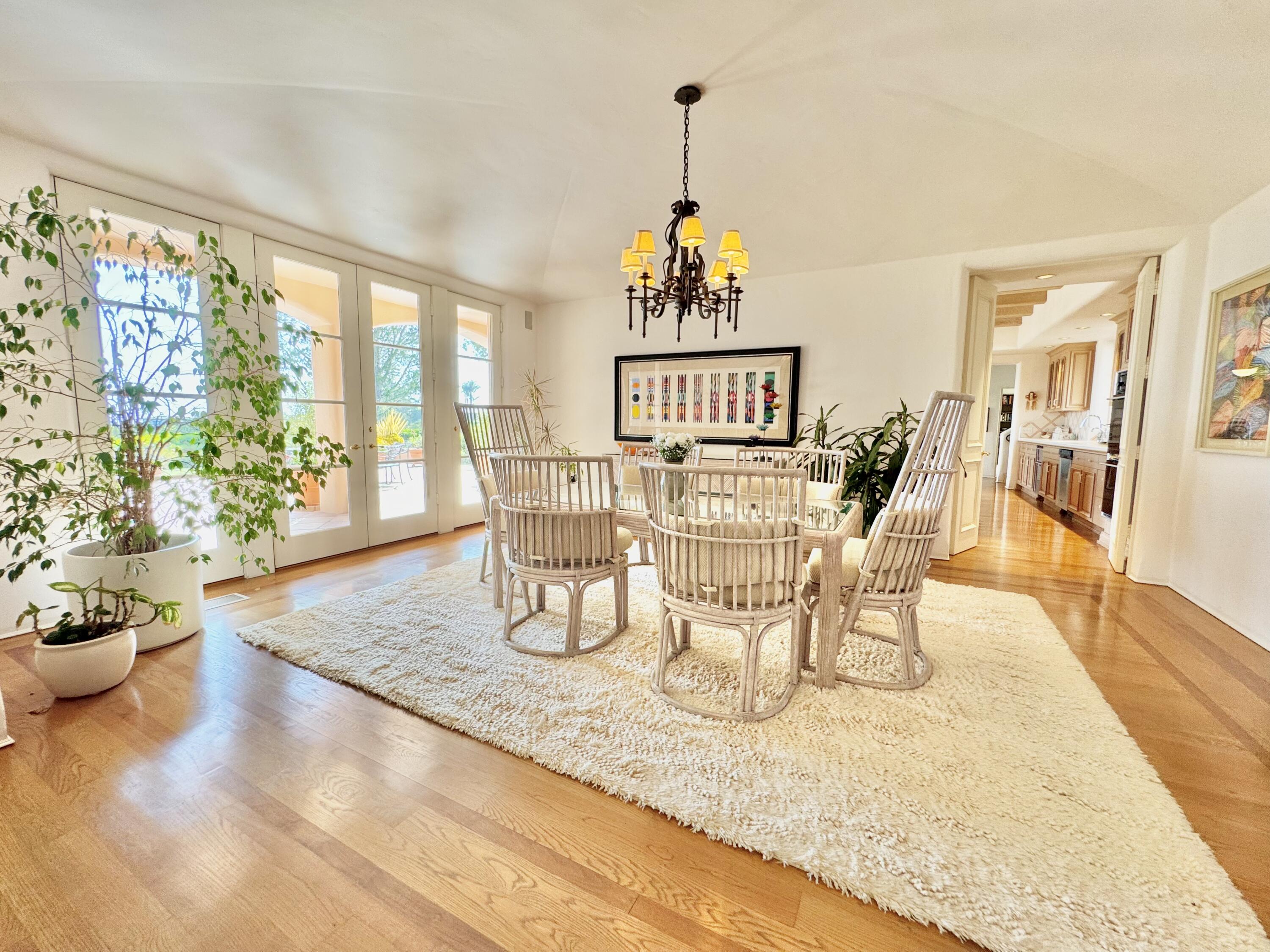 2240 Ortega Ranch Road Summerland, CA 93067 - Photo 39 of 87 a view of a dining room with furniture a chandelier and wooden floor