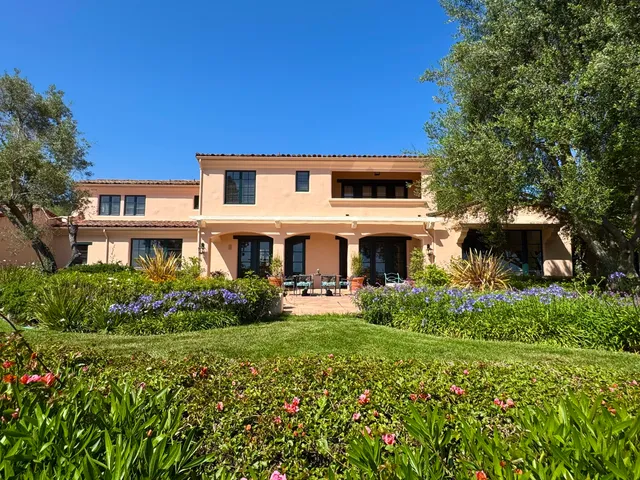 a view of a house with a garden