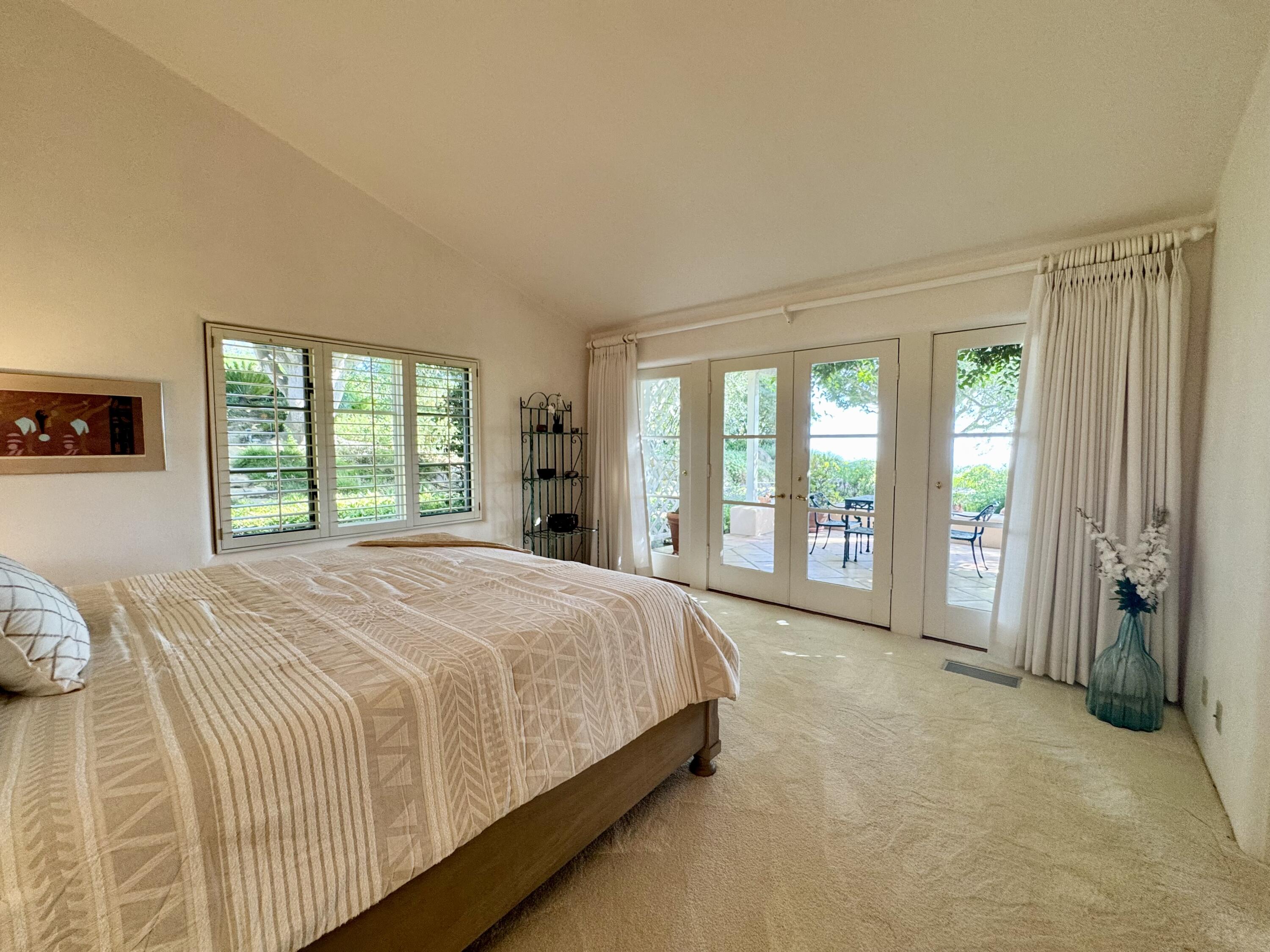 2240 Ortega Ranch Road Summerland, CA 93067 - Photo 41 of 87 a bed sitting in a spacious bedroom next to a window
