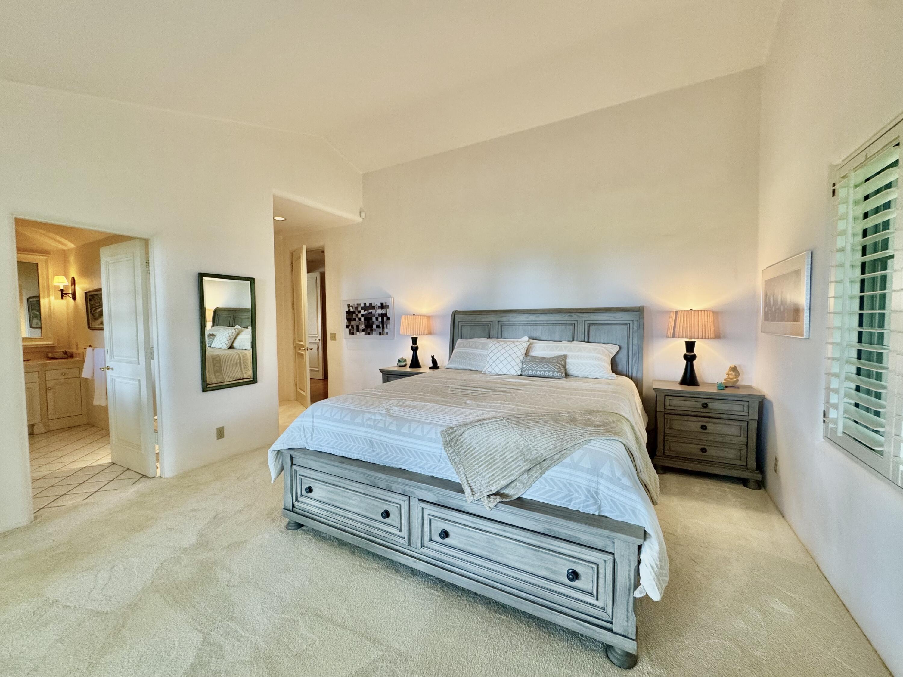 2240 Ortega Ranch Road Summerland, CA 93067 - Photo 43 of 87 a spacious bedroom with a bed and wooden floor