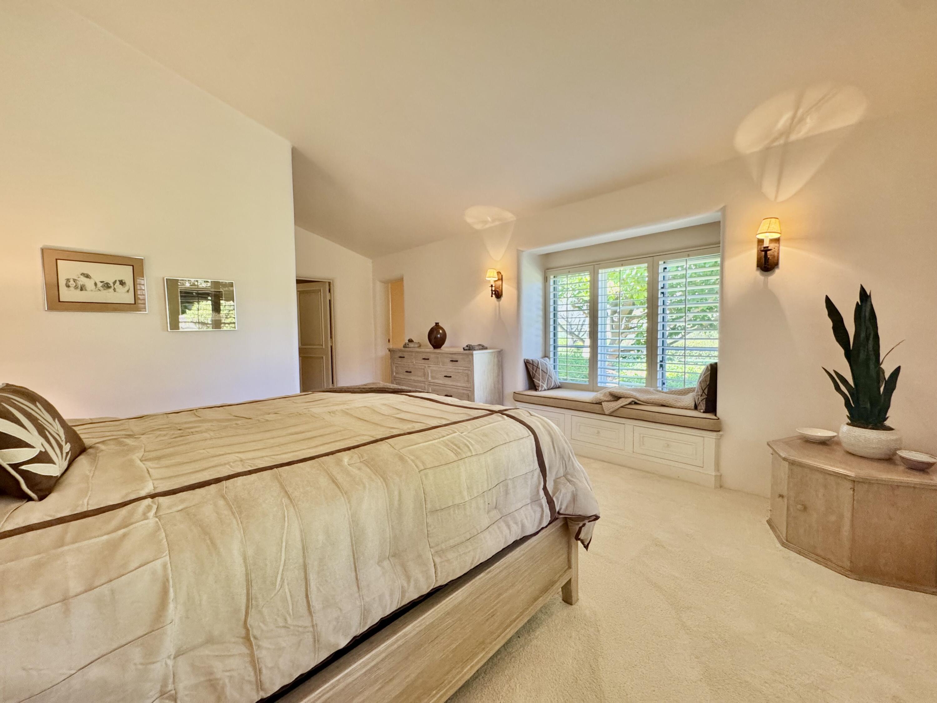 2240 Ortega Ranch Road Summerland, CA 93067 - Photo 47 of 87 a bed sitting in a spacious bedroom next to a window