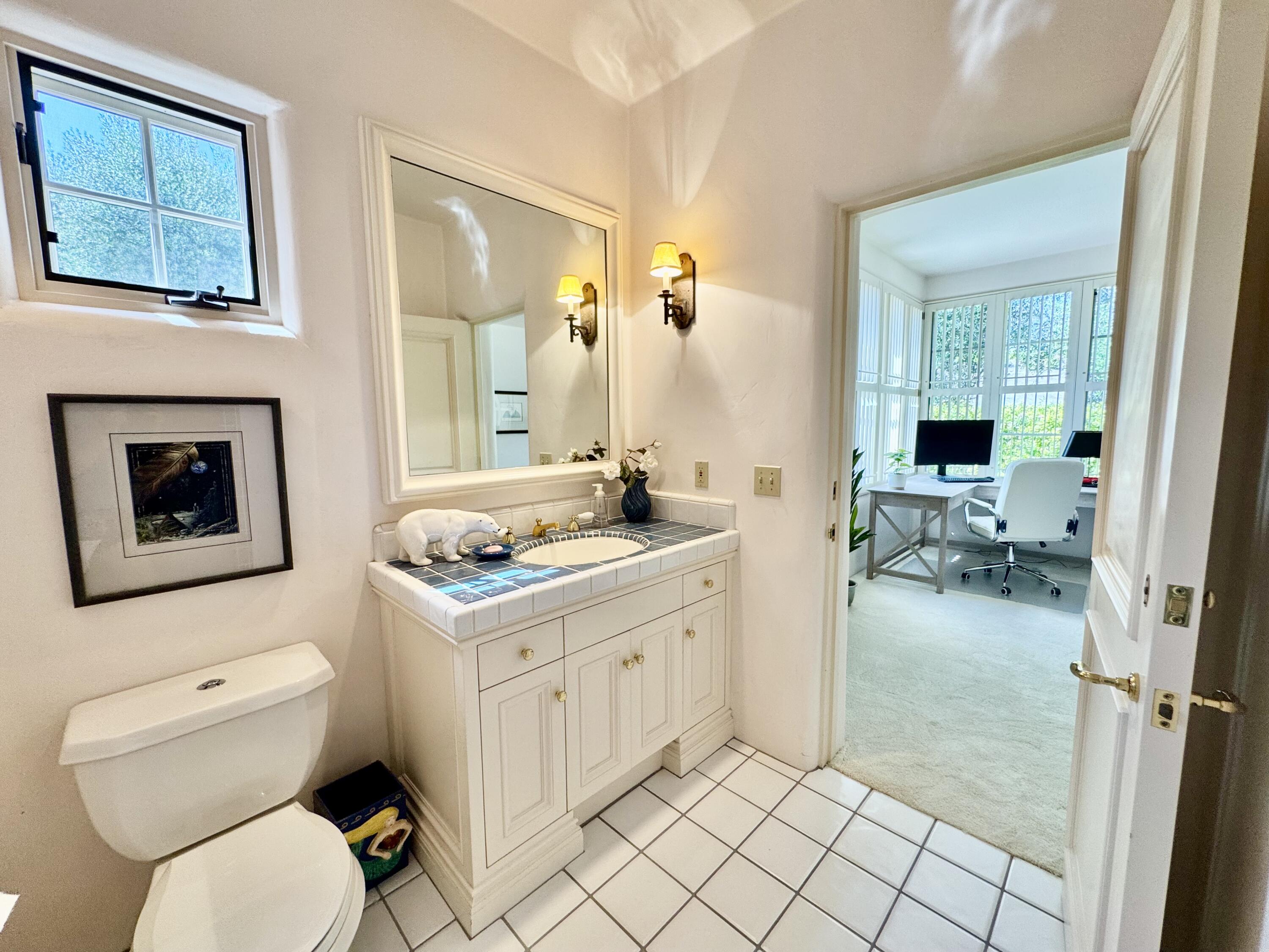 2240 Ortega Ranch Road Summerland, CA 93067 - Photo 52 of 87 a bathroom with a toilet sink and mirror