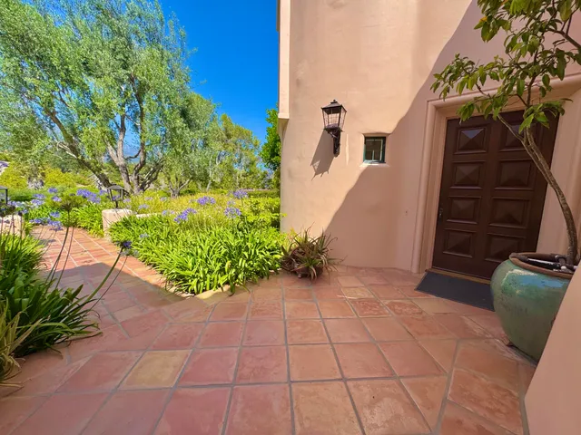 a living room with furniture fireplace and a large window