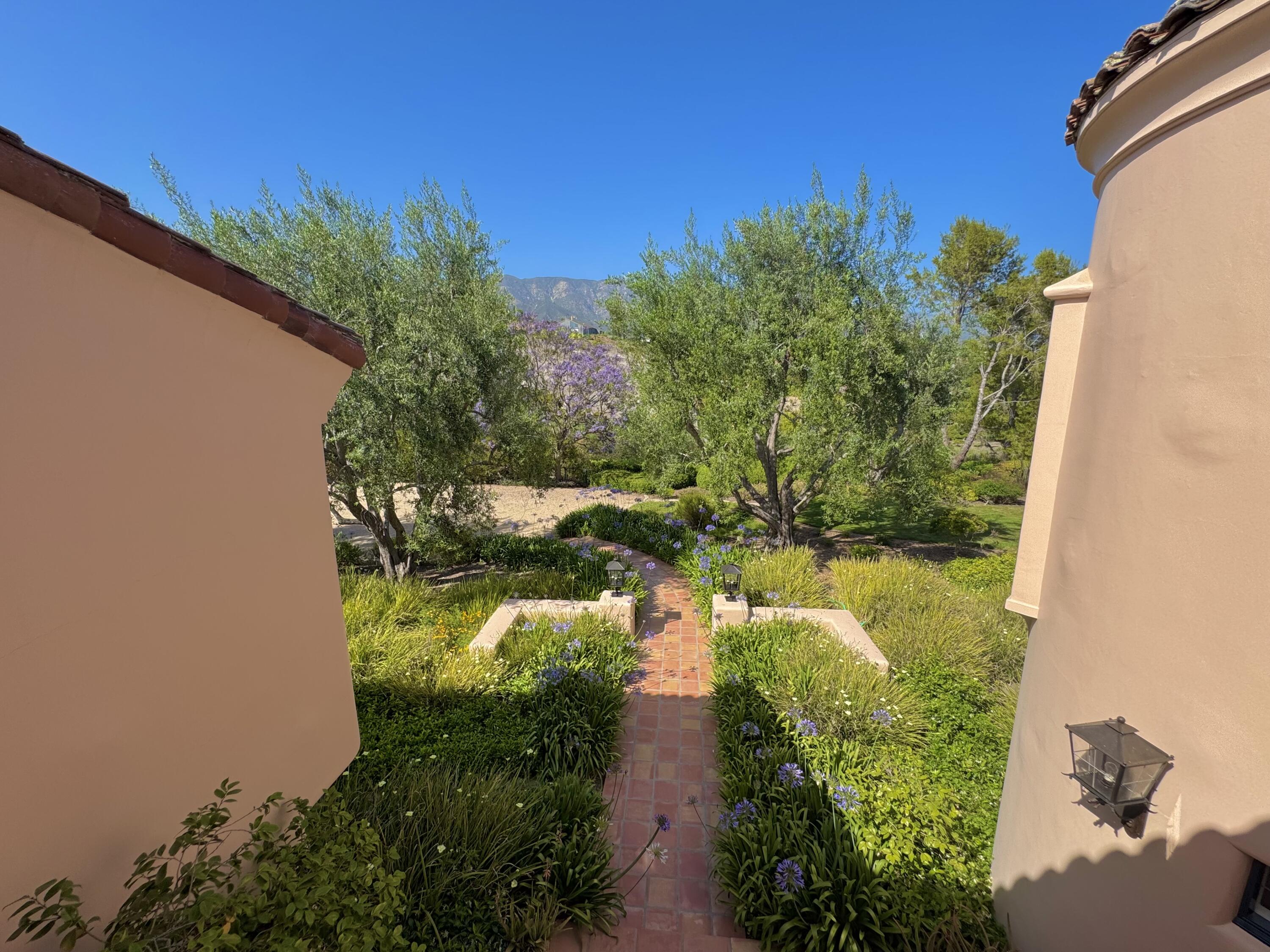 2240 Ortega Ranch Road Summerland, CA 93067 - Photo 81 of 87 a backyard of a house with a yard and outdoor seating