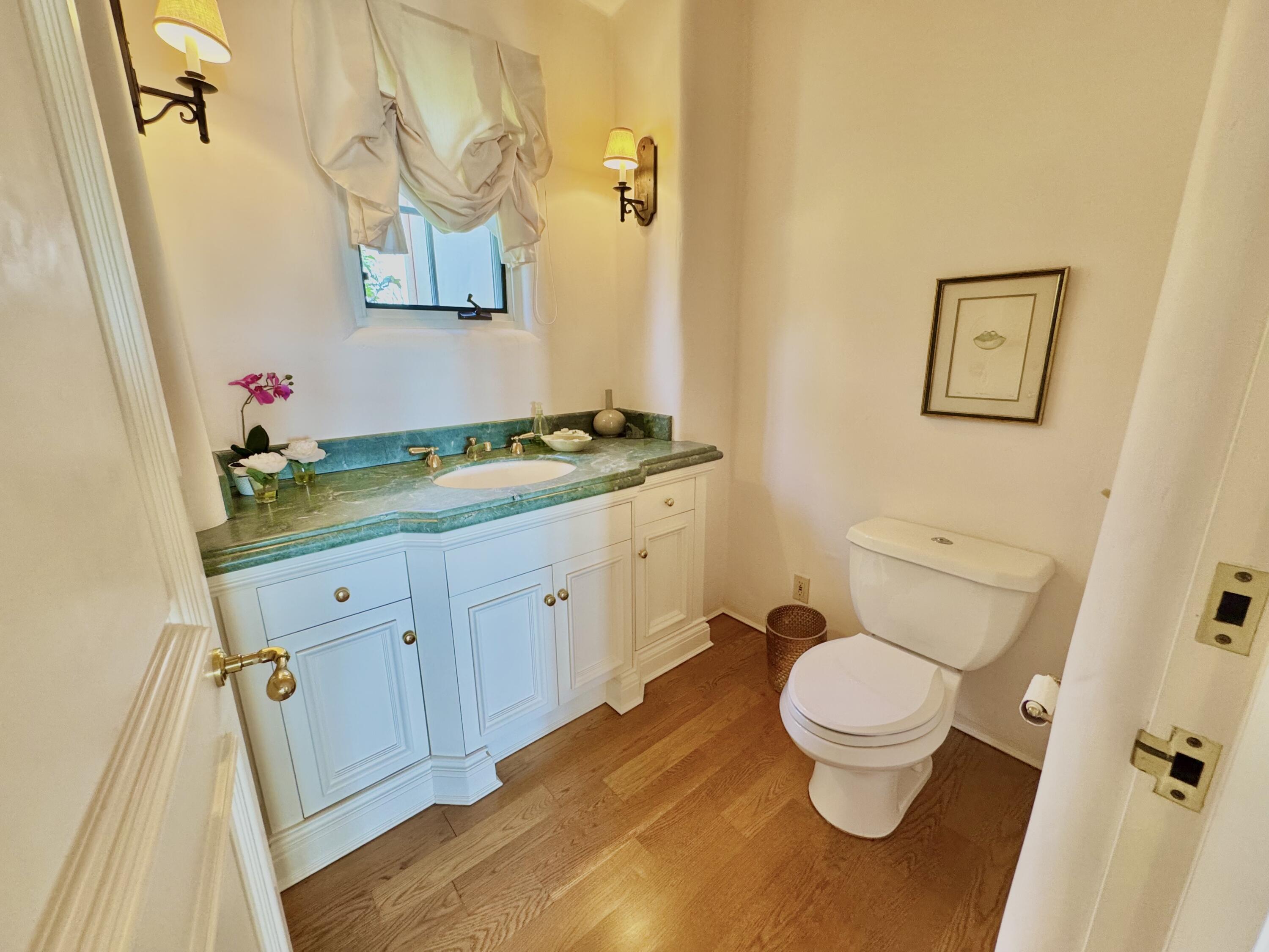 2240 Ortega Ranch Road Summerland, CA 93067 - Photo 9 of 87 a bathroom with a granite countertop toilet sink and mirror