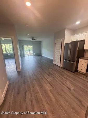 a view of a livingroom with wooden floor