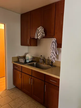 a kitchen with a sink and cabinets