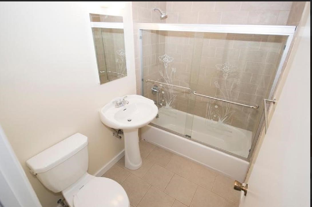 2636 Warring Street, Unit 103 Berkeley, CA 94704 - Photo 6 of 8 a bathroom with a sink toilet and shower