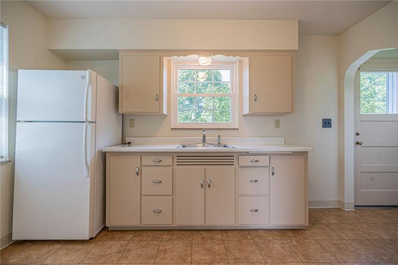 915 Wible Run Road Pittsburgh, PA 15209 - Photo 11 of 25 Charming Kitchen With Backyard Views