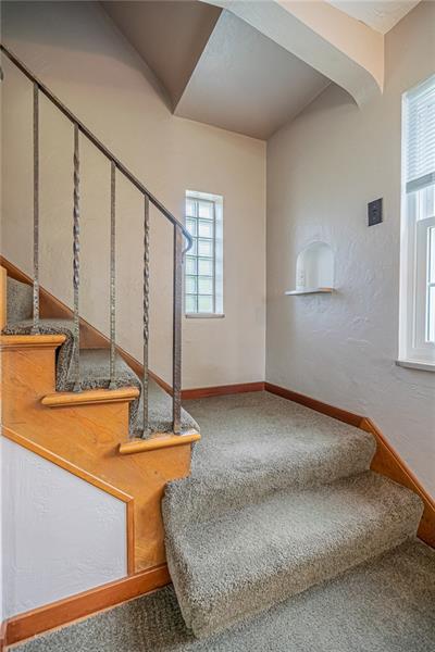 915 Wible Run Road Pittsburgh, PA 15209 - Photo 13 of 25 Staircase to Second Level - Glass Block Window & Iron Railing
