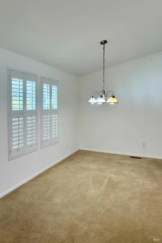 a view of a room with a large window