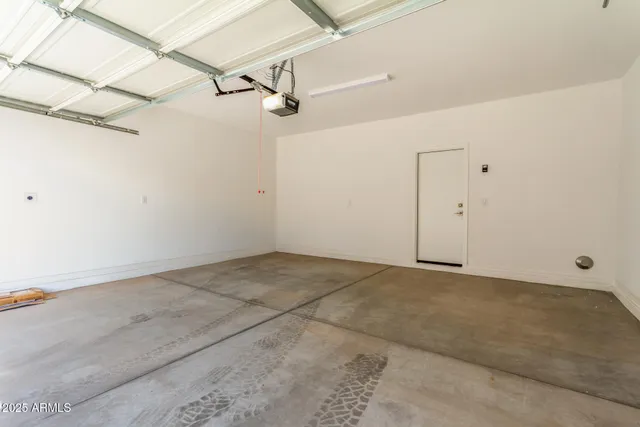 a view of a room with a ceiling fan