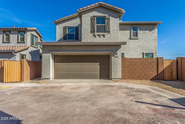 a front view of a house with a garage