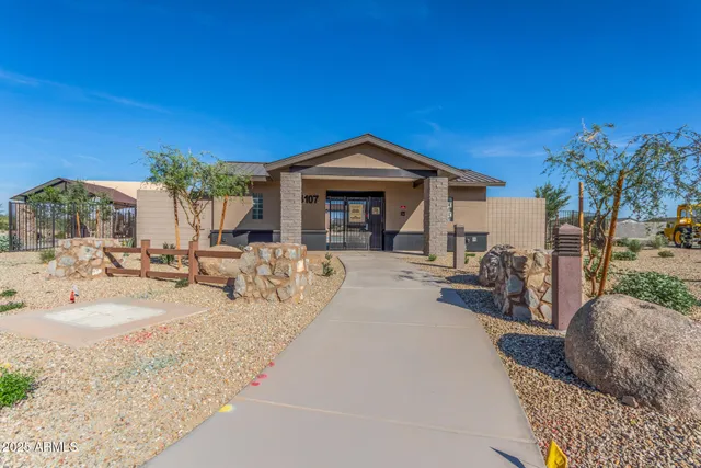 a view of a house with backyard porch and sitting area