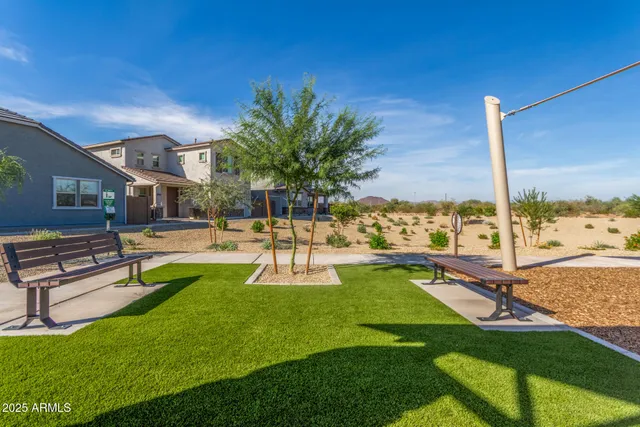 a swimming pool with outdoor seating and yard