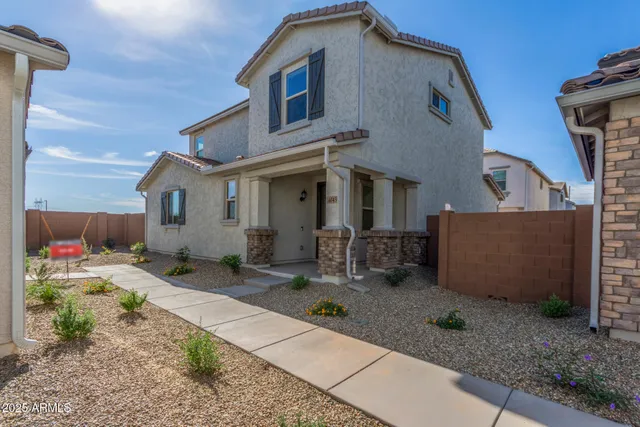 a front view of a house with patio