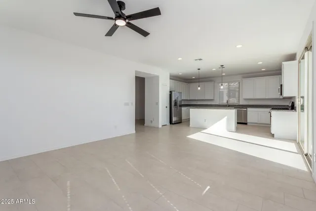 a view of a kitchen with a sink and cabinets