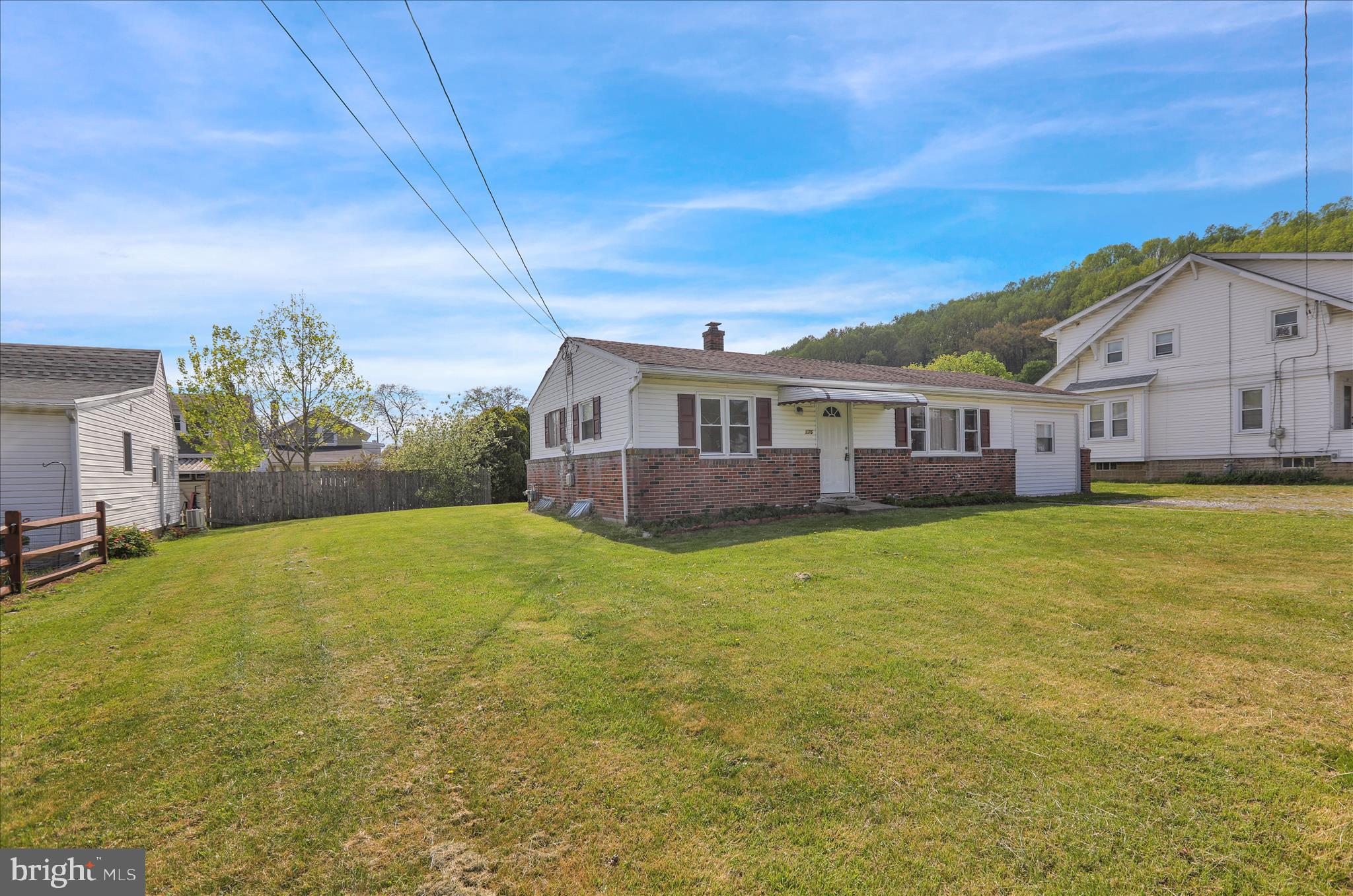 a view of a house with a big yard