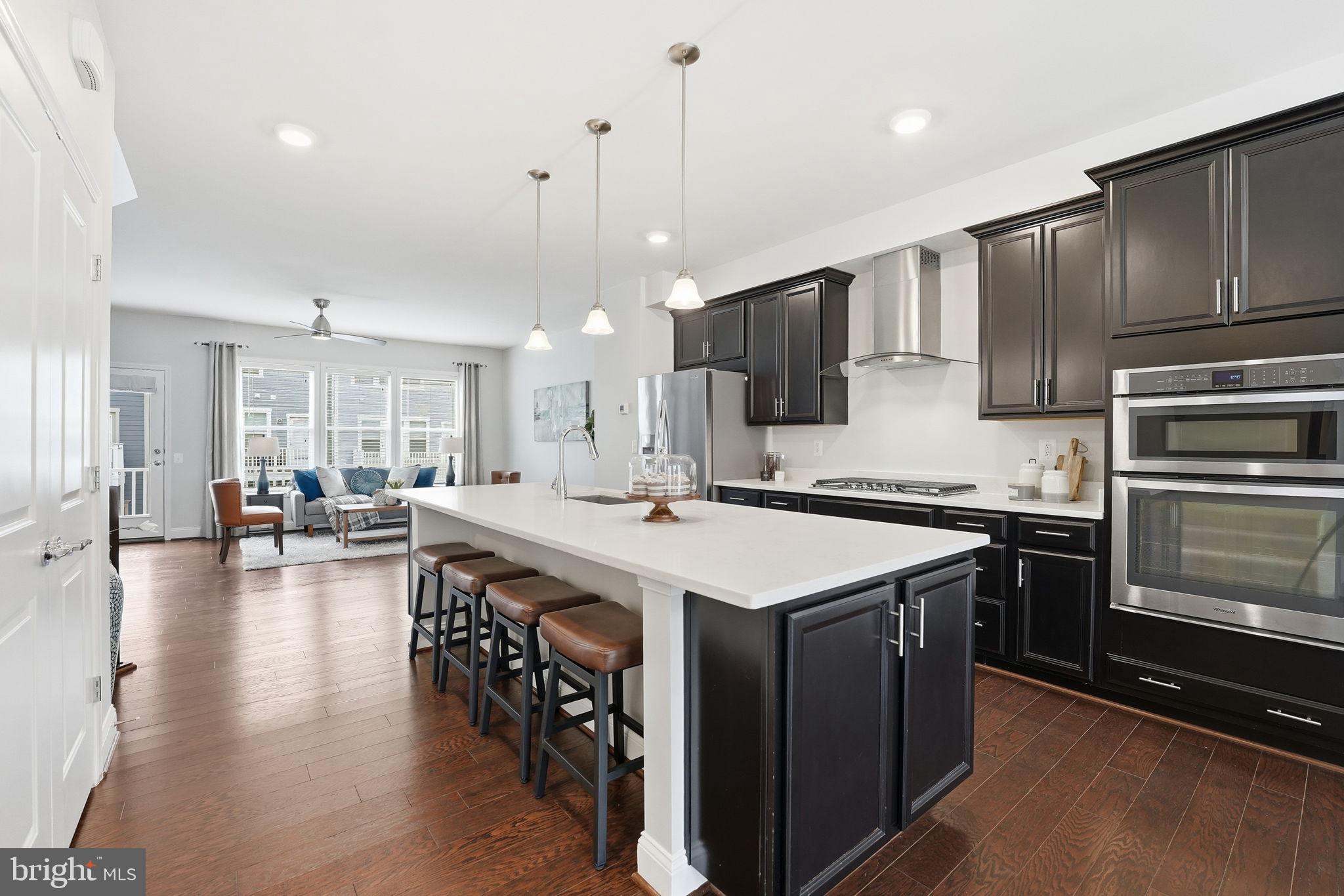 17354 Redshank Road Dumfries, VA 22026 - Photo 14 of 65 a large kitchen with lots of counter space a sink appliances and dining room