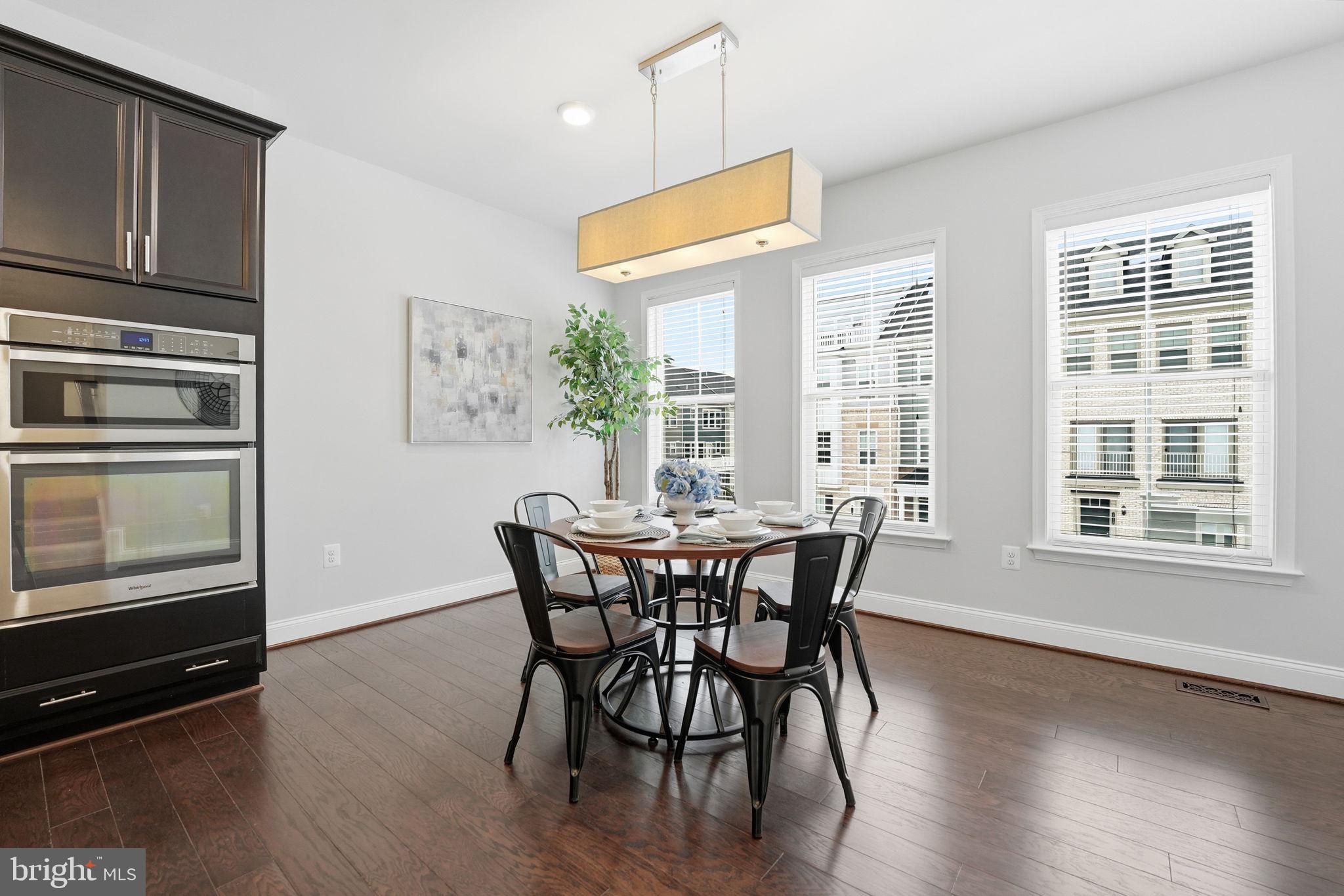 17354 Redshank Road Dumfries, VA 22026 - Photo 15 of 65 a view of a dining room with furniture window and wooden floor