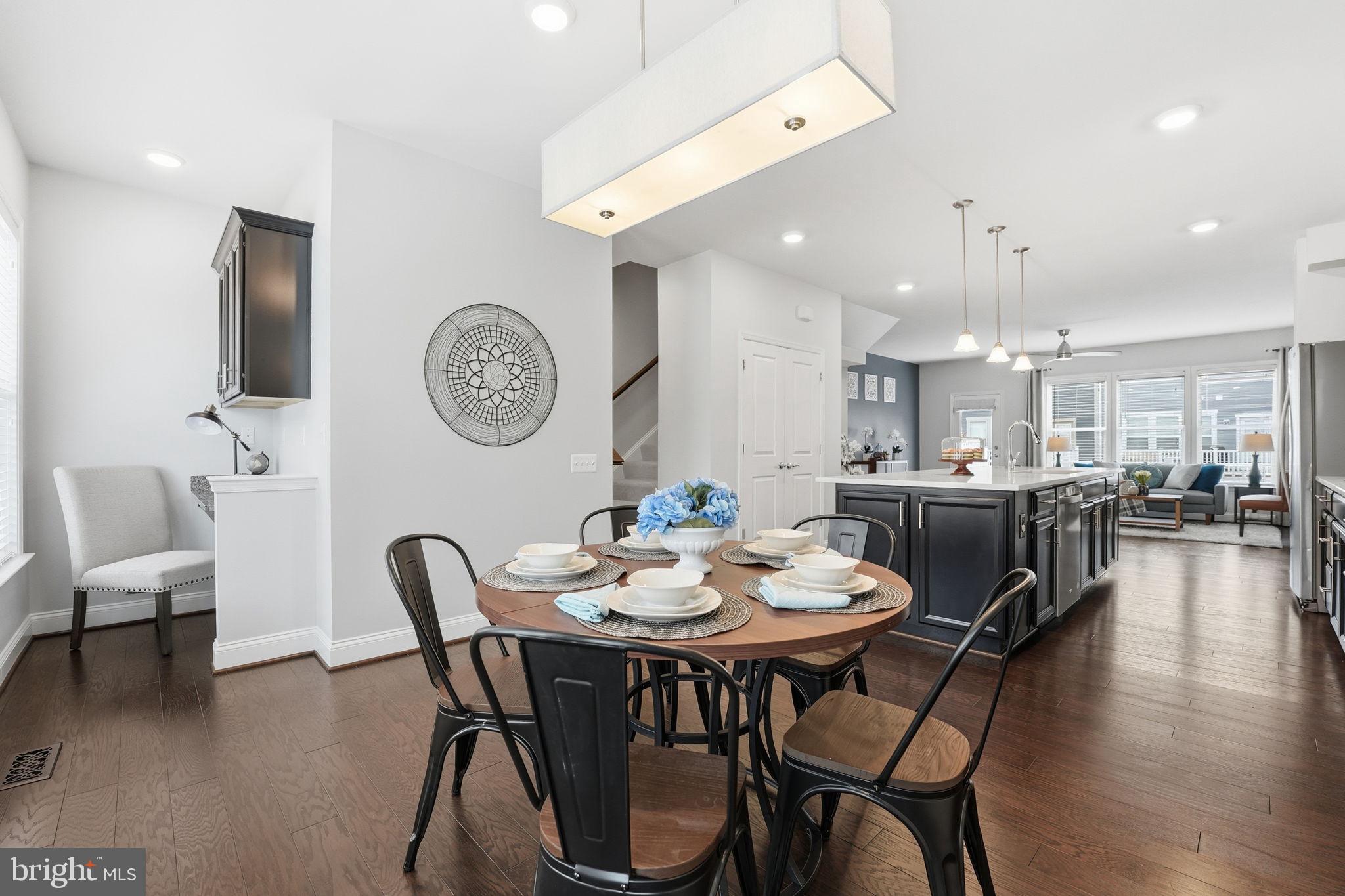 17354 Redshank Road Dumfries, VA 22026 - Photo 16 of 65 a view of a dining room with furniture and wooden floor
