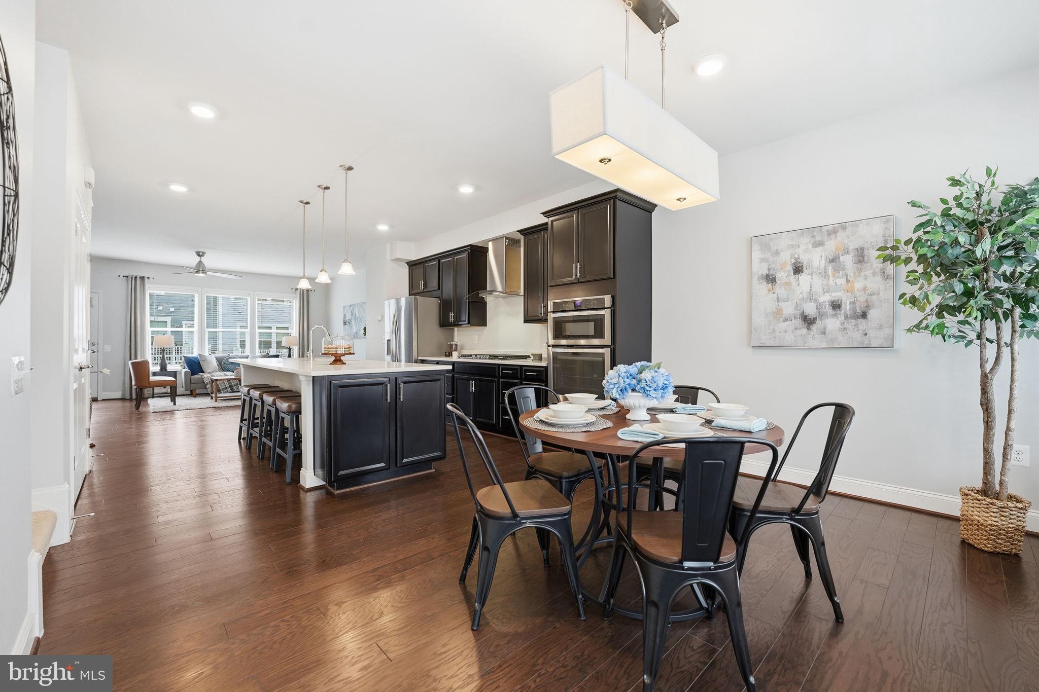 17354 Redshank Road Dumfries, VA 22026 - Photo 18 of 65 a dining room with furniture and wooden floor