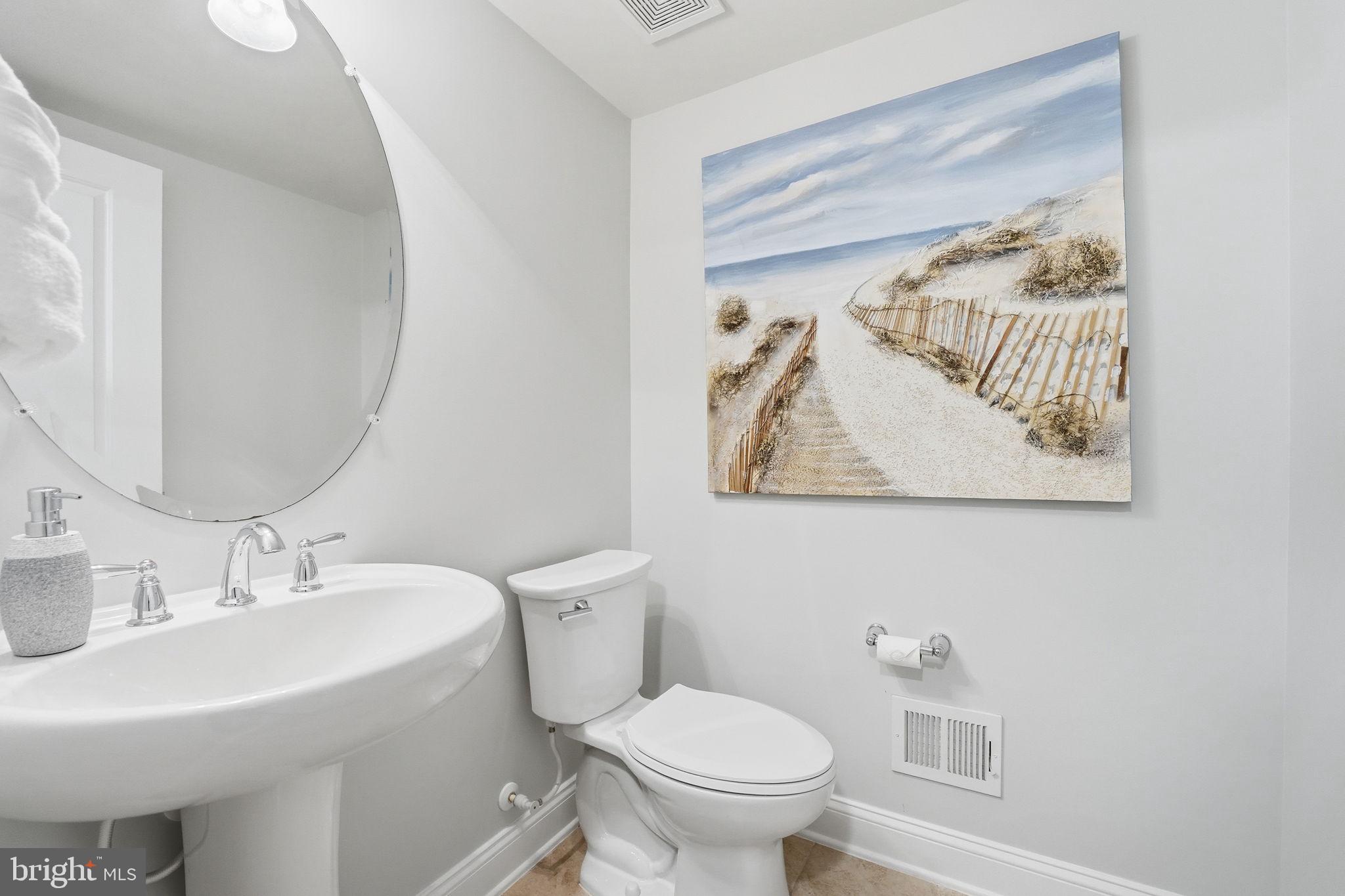 17354 Redshank Road Dumfries, VA 22026 - Photo 20 of 65 a bathroom with a toilet and a sink