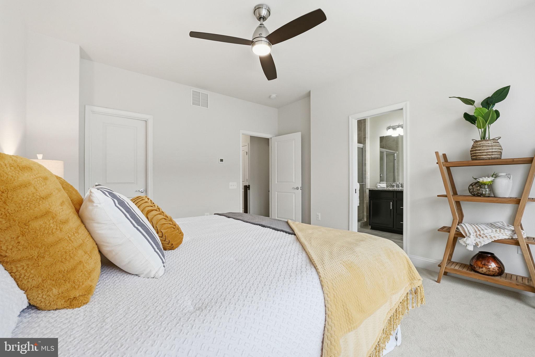 17354 Redshank Road Dumfries, VA 22026 - Photo 23 of 65 a bed room with a bed and a chair