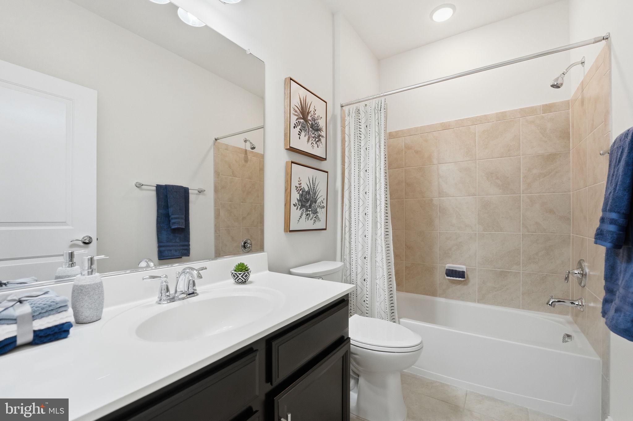 17354 Redshank Road Dumfries, VA 22026 - Photo 30 of 65 a bathroom with a sink a toilet and shower