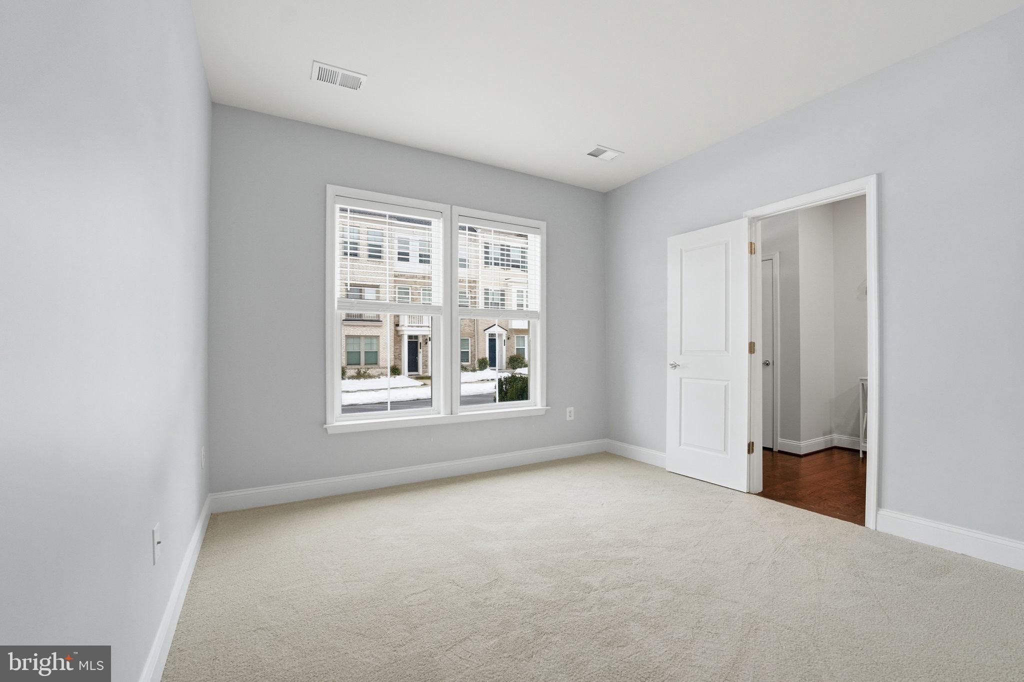 17354 Redshank Road Dumfries, VA 22026 - Photo 3 of 65 a view of an empty room with a window