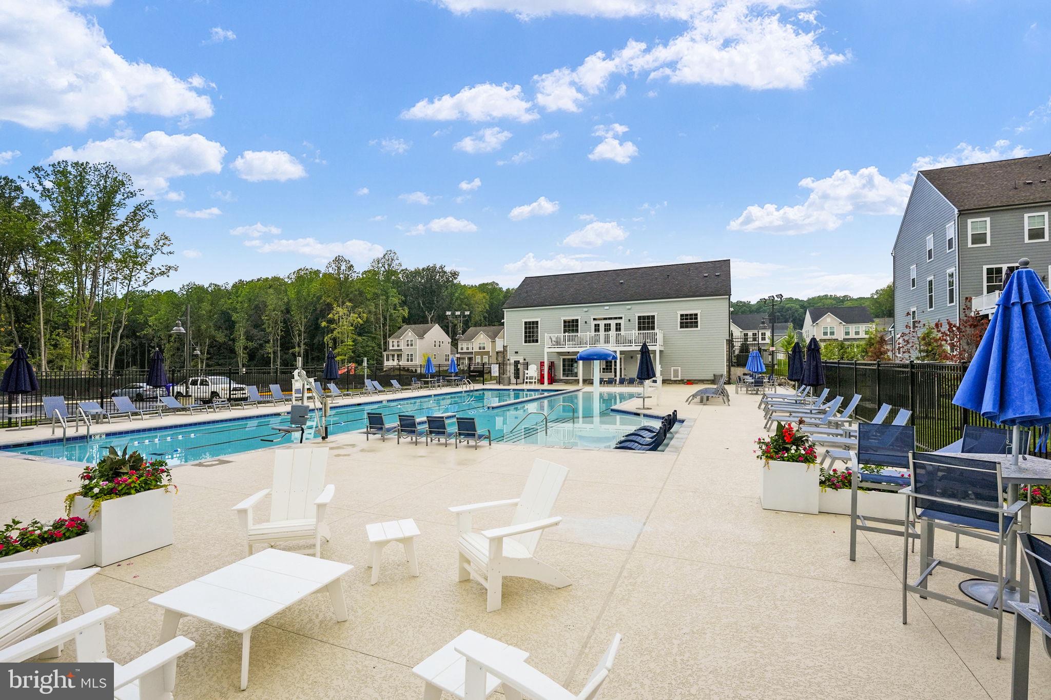 17354 Redshank Road Dumfries, VA 22026 - Photo 60 of 65 a view of a patio with swimming pool table and chairs