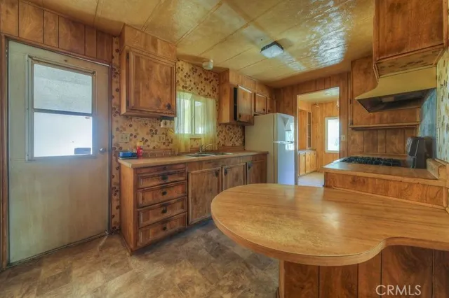 a kitchen with stainless steel appliances granite countertop a stove and a sink