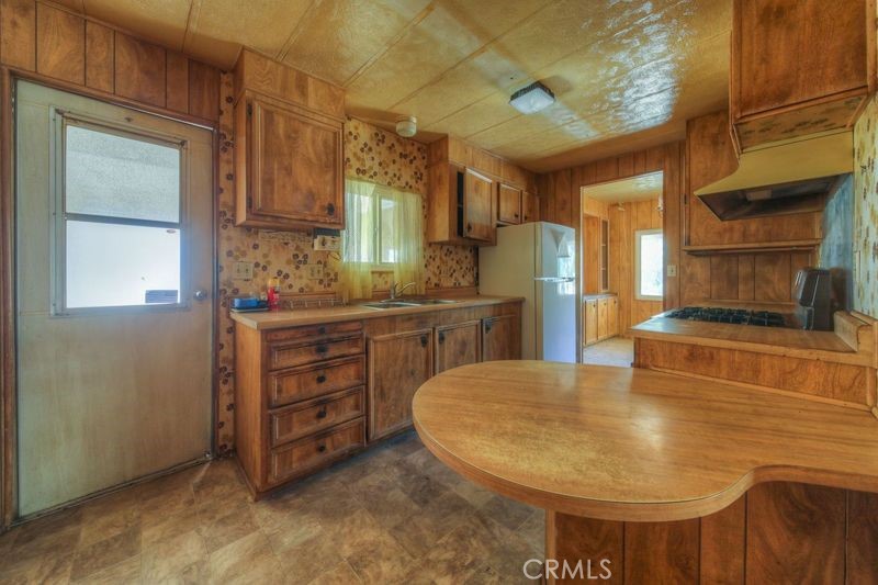 55743 Mitchell Road Anza, CA 92539 - Photo 17 of 46 a kitchen with a sink and cabinets