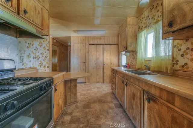 a bathroom with shower sink and mirror