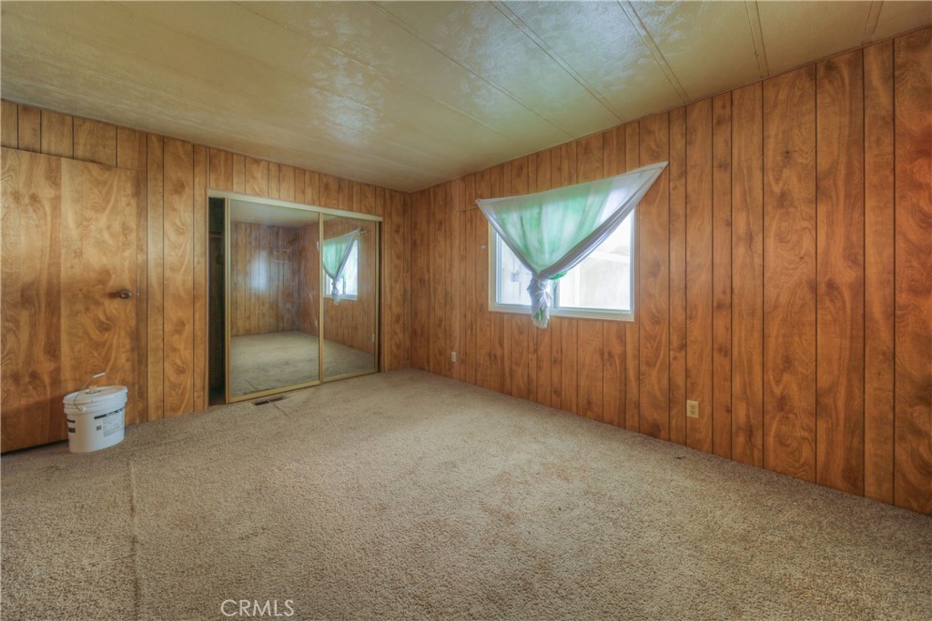 55743 Mitchell Road Anza, CA 92539 - Photo 26 of 46 an empty room with windows and closet