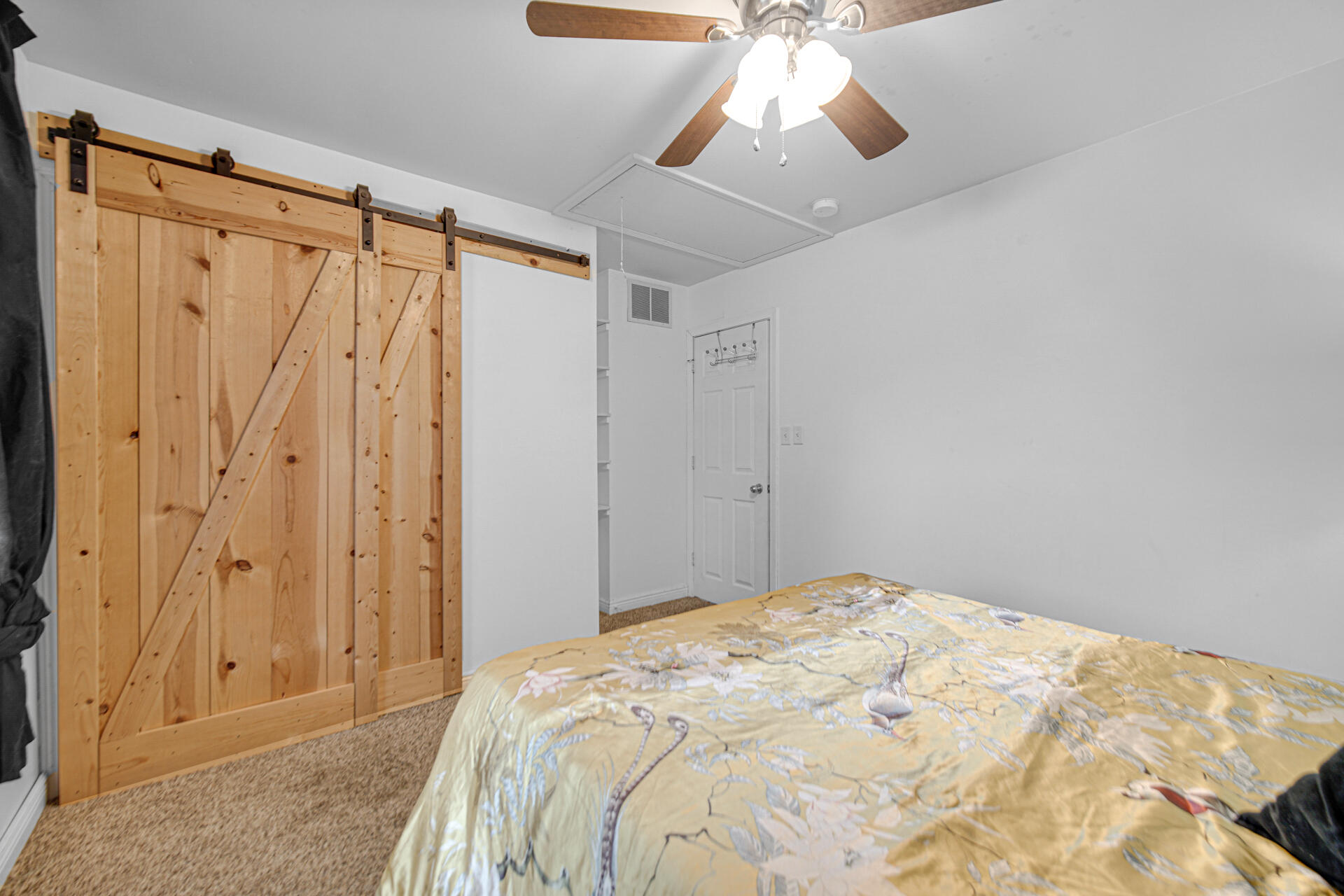 2009 West Porter Avenue Chesterton, IN 46304 - Photo 14 of 21 a bedroom with a large bed and a chandelier fan