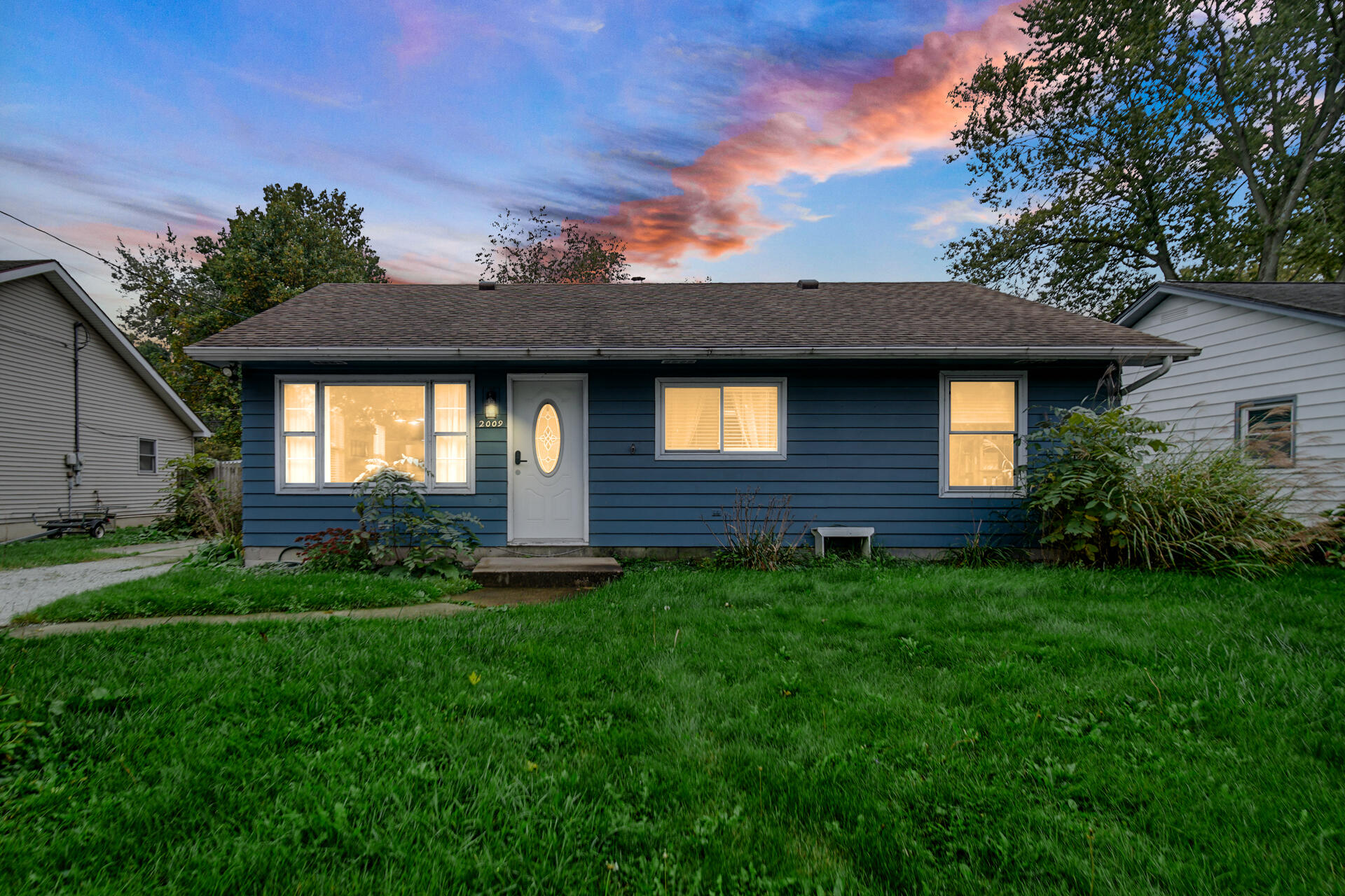 2009 West Porter Avenue Chesterton, IN 46304 - Photo 2 of 21 a front view of a house with a garden