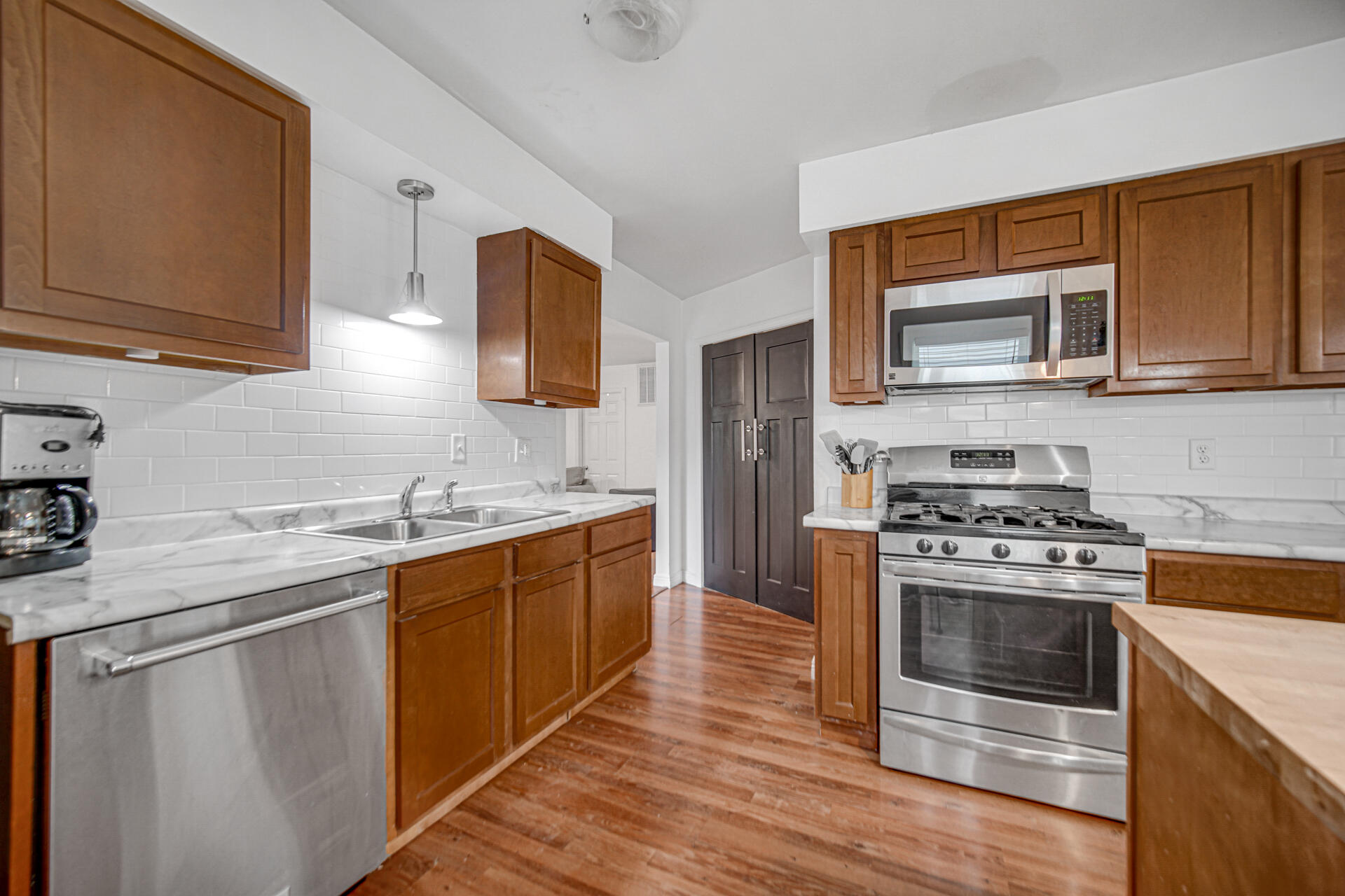 2009 West Porter Avenue Chesterton, IN 46304 - Photo 8 of 21 a kitchen with stainless steel appliances granite countertop a stove a sink dishwasher and a refrigerator