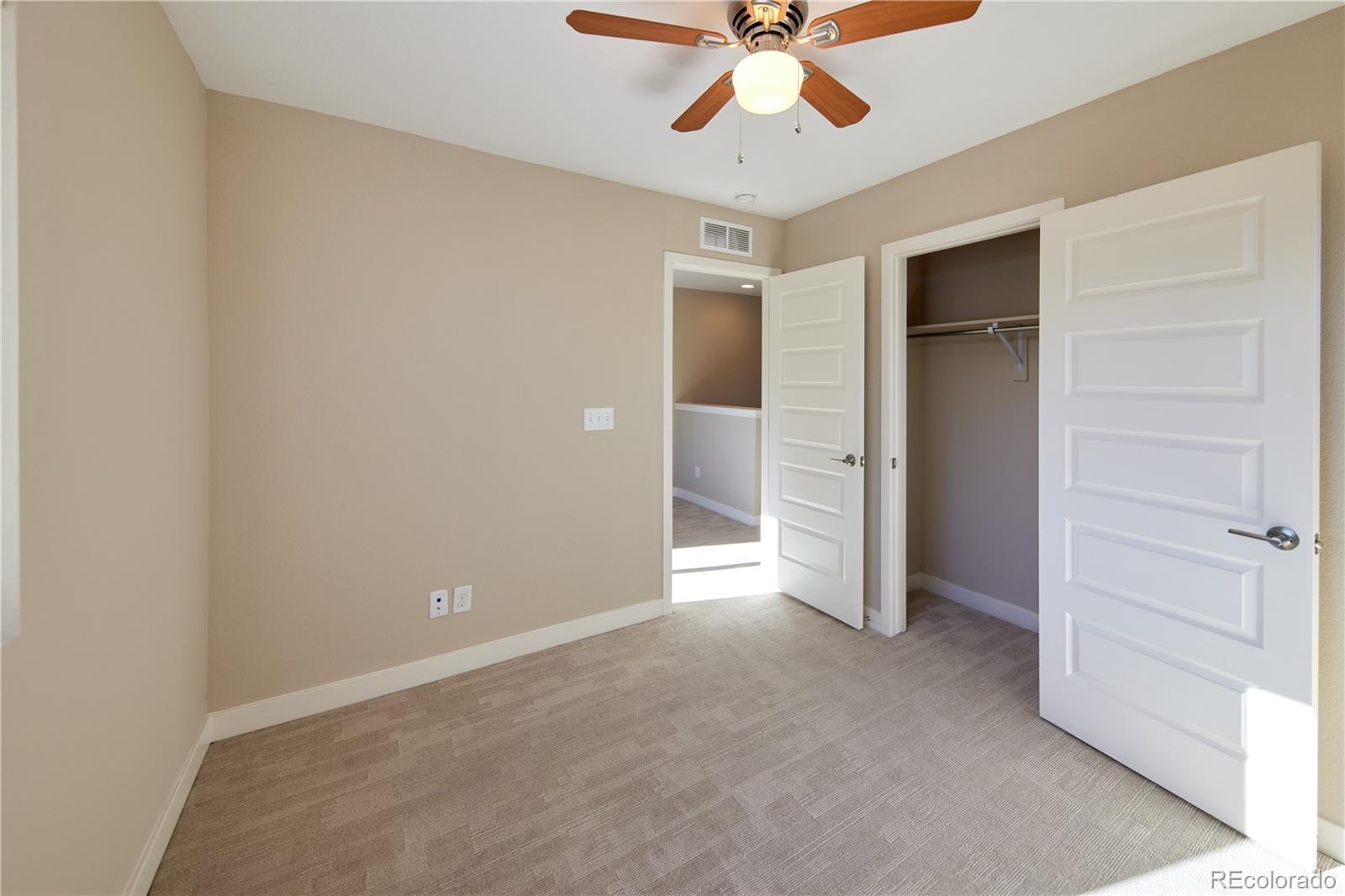11225 Colony Row Broomfield, CO 80021 - Photo 17 of 31 an empty room with closet and a ceiling fan