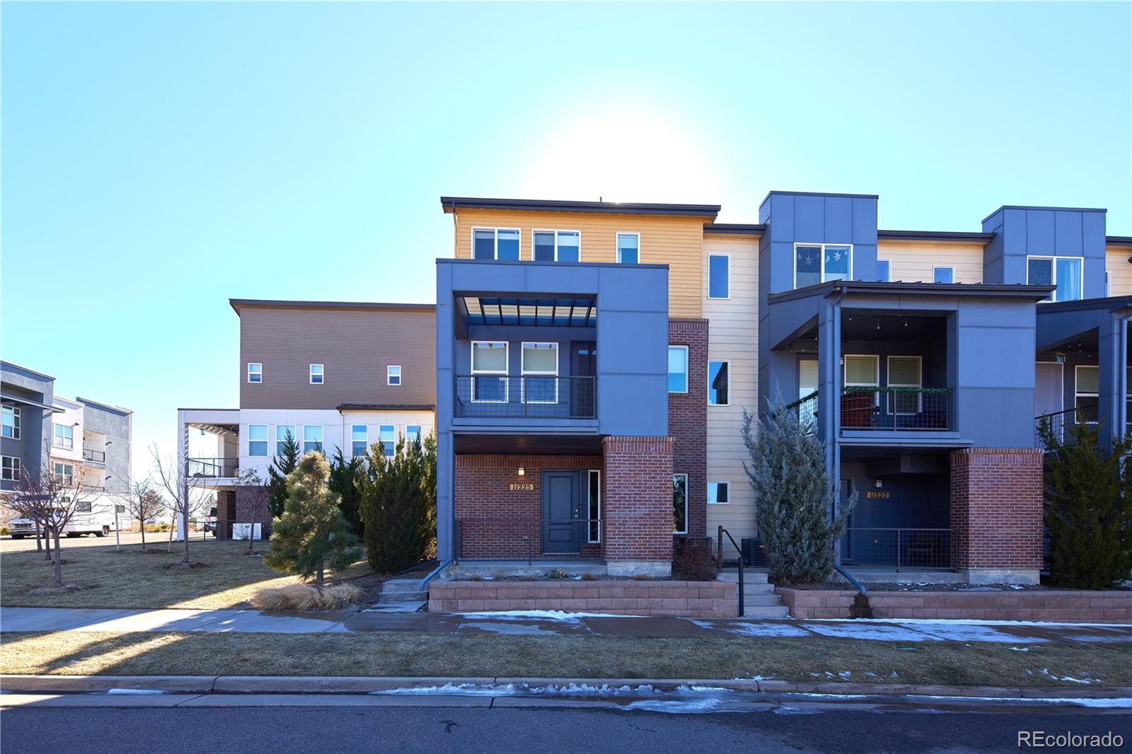 11225 Colony Row Broomfield, CO 80021 - Photo 2 of 31 a front view of a multi story residential apartment building