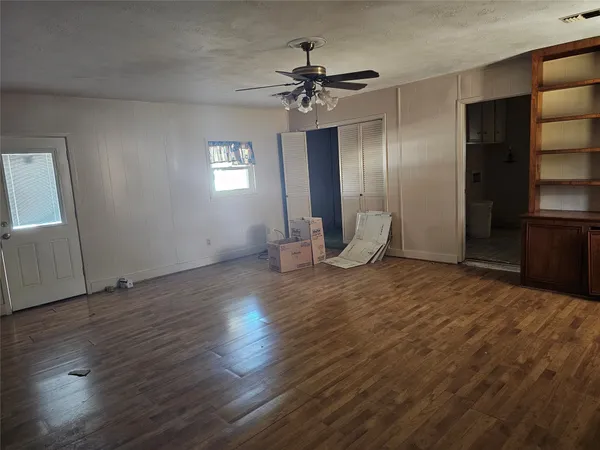 a view of an empty room with a window