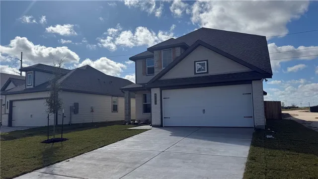 a house view with a fireplace and a chandelier