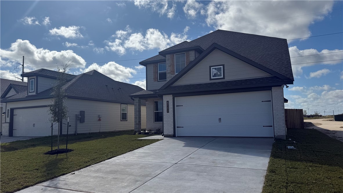 4752 Holm Oak Road Bryan, TX 77845 - Photo 2 of 8 a house view with a fireplace and a chandelier