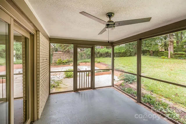 a view of an entryway with a floor to ceiling window