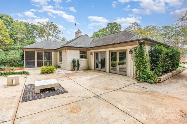 a view of house with yard and entertaining space