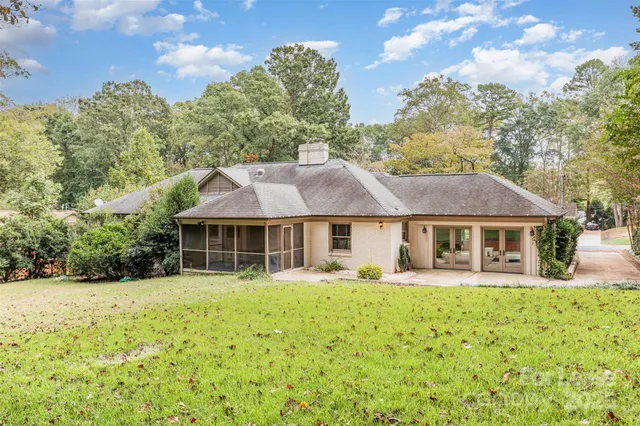 a front view of a house with a yard table and chairs