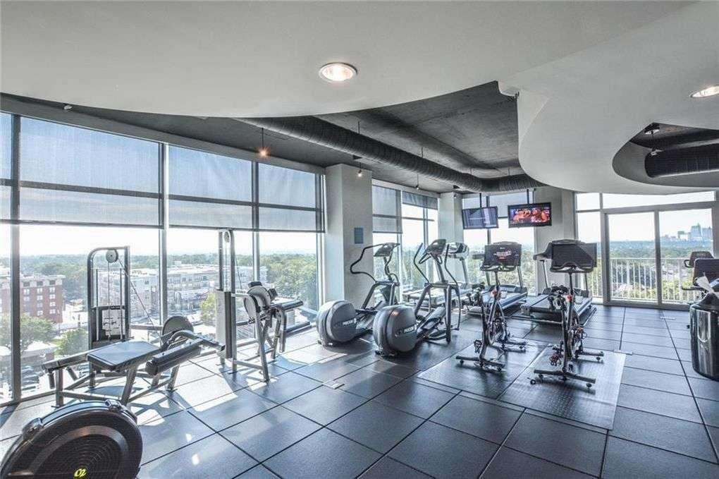250 Pharr Road Northeast, Unit 2002 Atlanta, GA 30305 - Photo 8 of 13 a view of a room with gym equipment